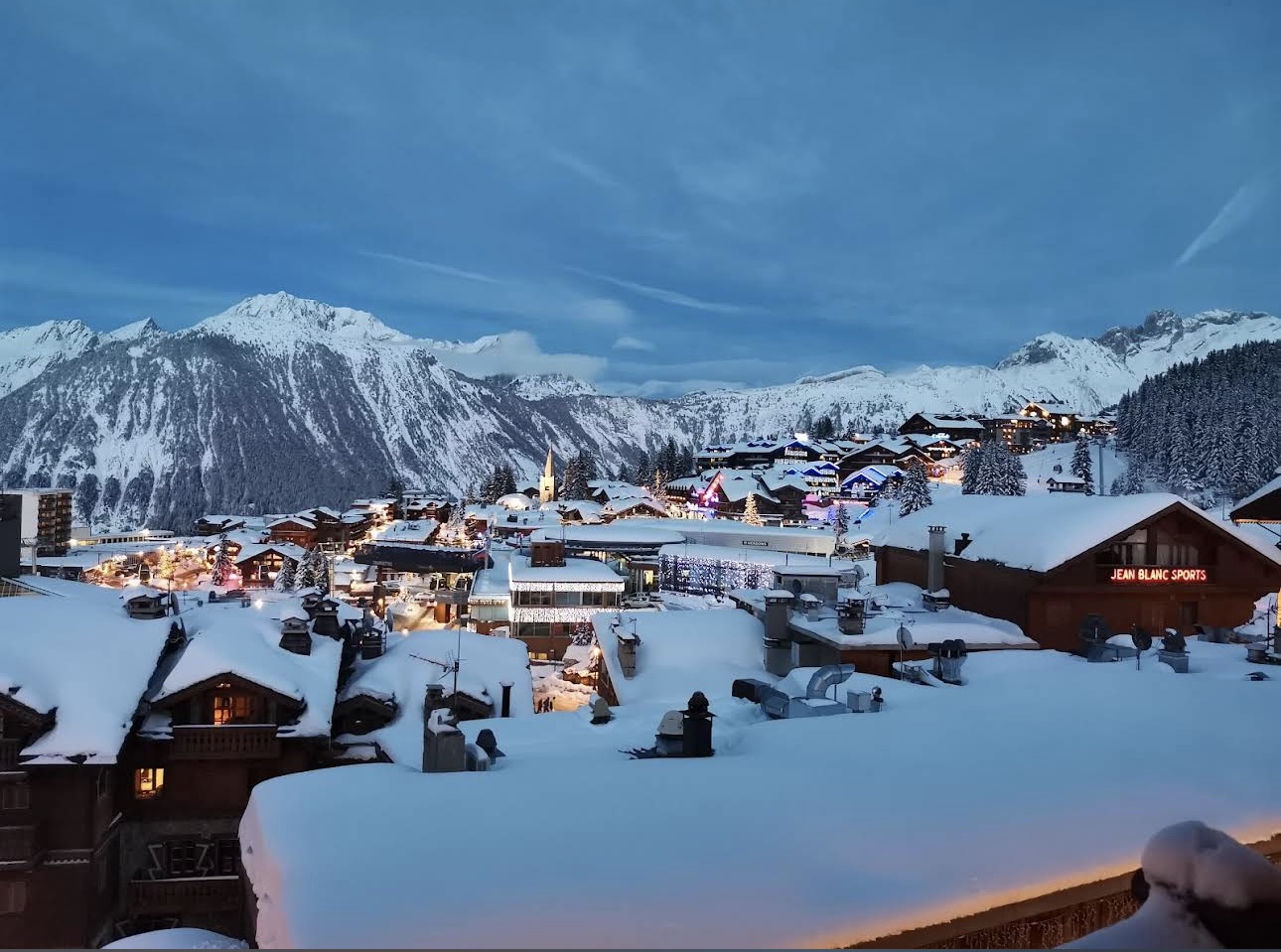 Chalets and snow covered roofs in Courchevel