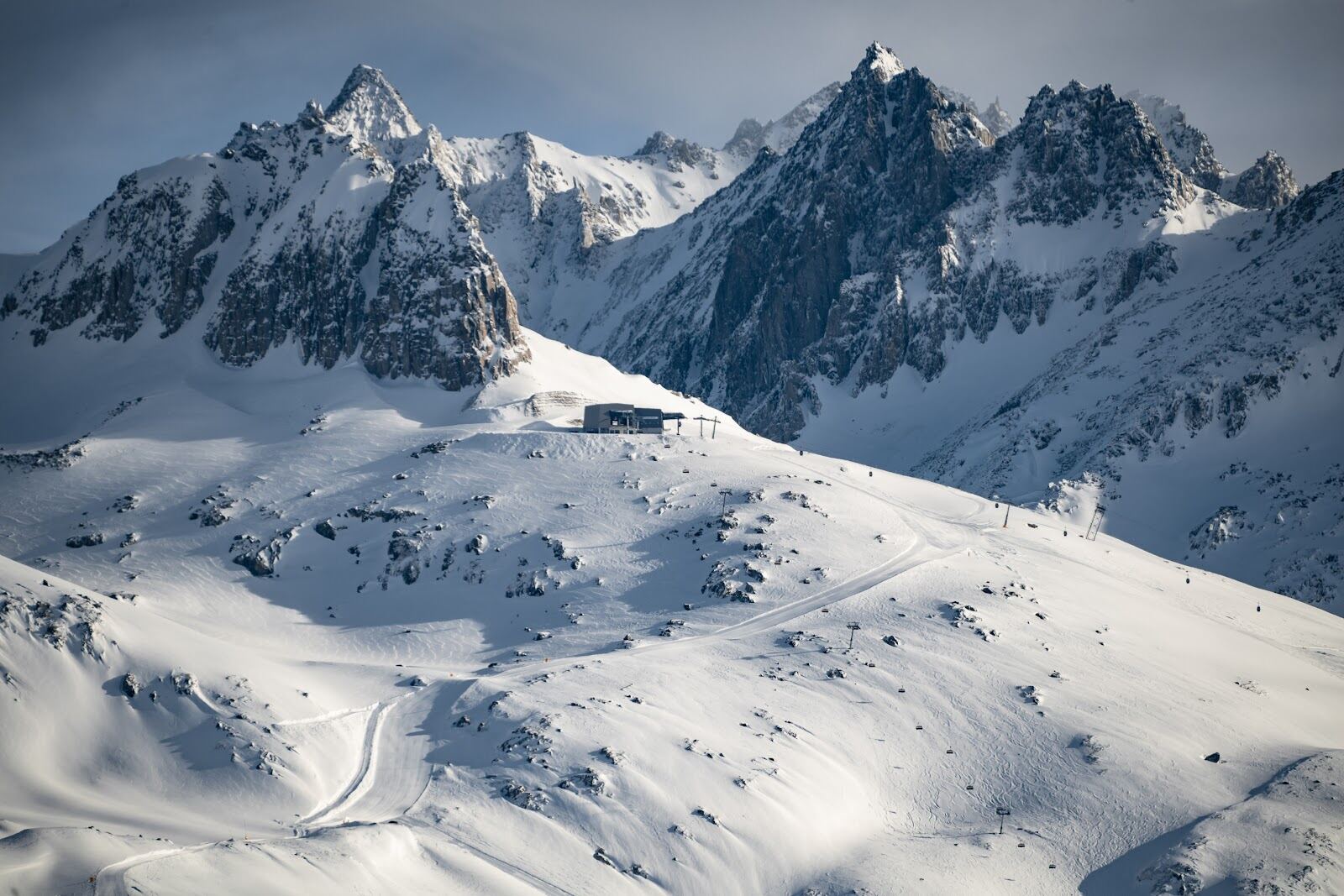 The Benedictine monastery of Disentis above the snowy village and ski slopes