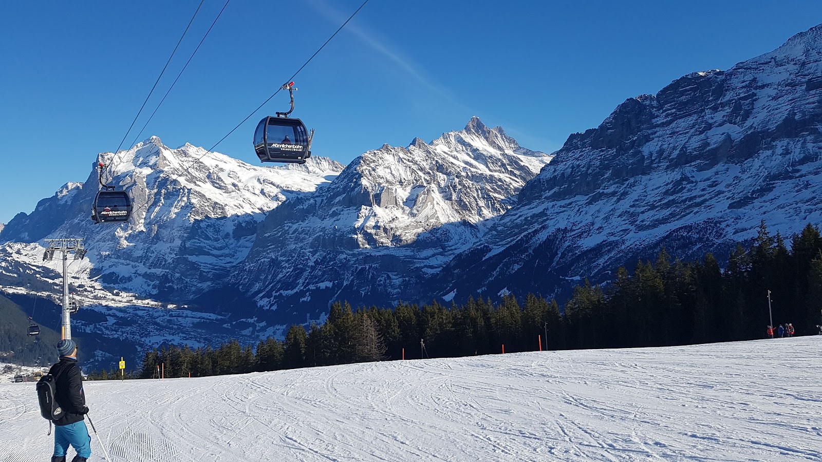 The Eiger Monch and Jungfrau peaks rising above the Grindelwald valley