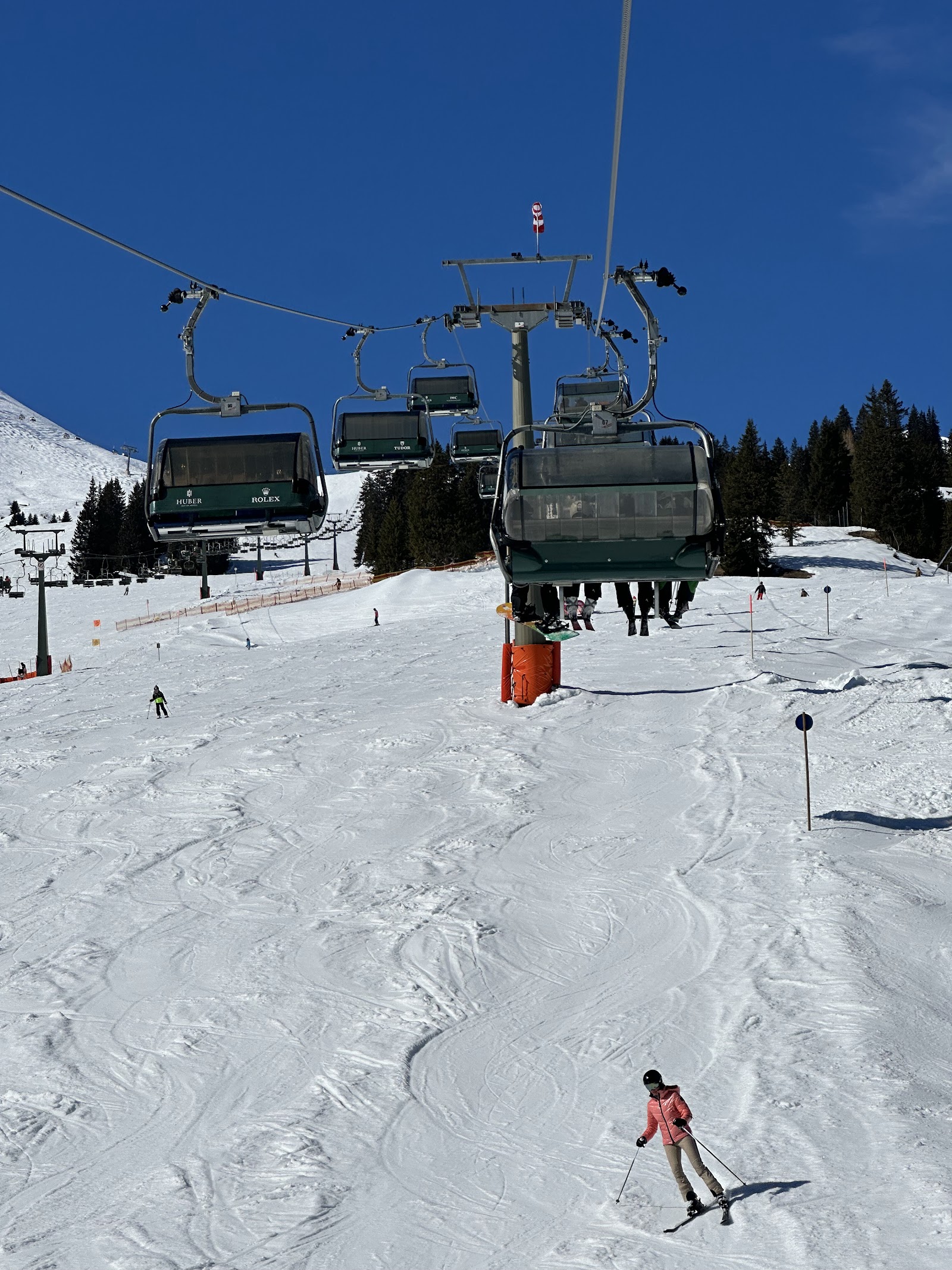 Skiers cruising the snowy Arlberg slopes above Lech