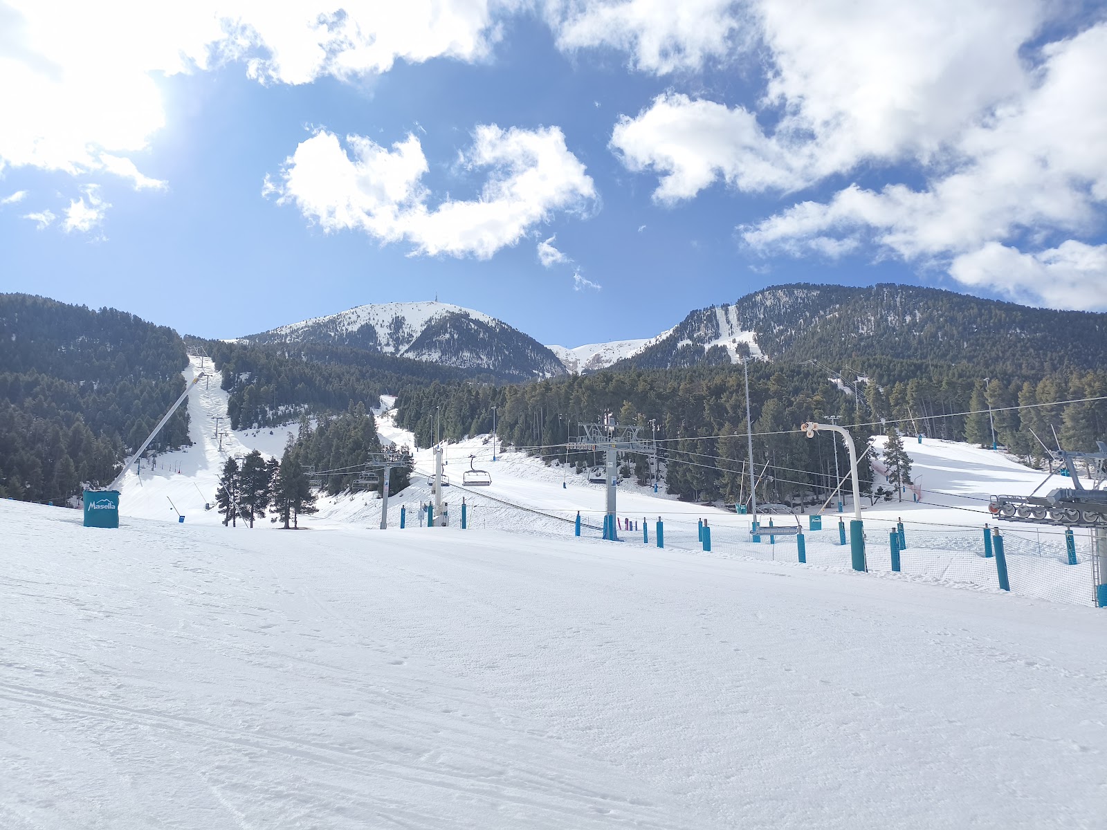 Wide groomed beginner slopes near the Masella base