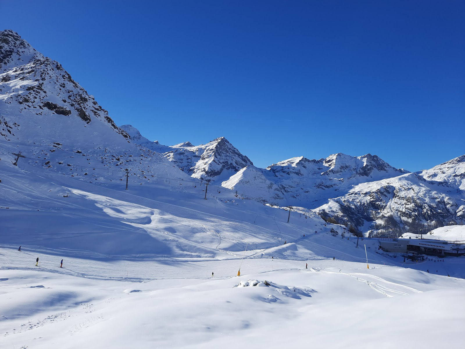 Lift rising above a quiet Aosta Valley village in winter