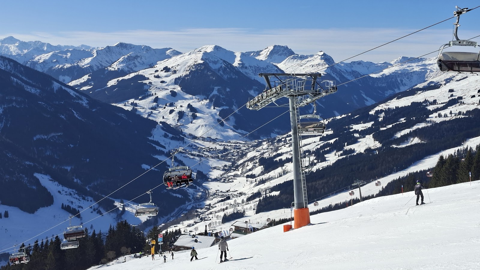 Chairlifts and pisted slopes ringing the Glemmtal valley at Saalbach