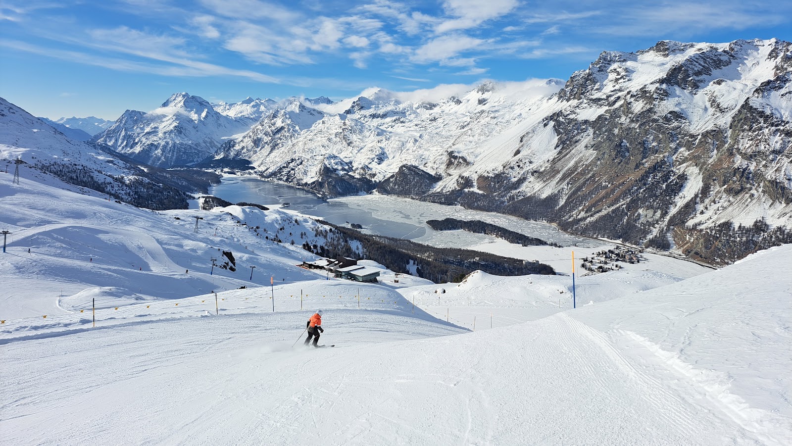 The town of St Moritz above its frozen lake in the high Engadin under a bright sky