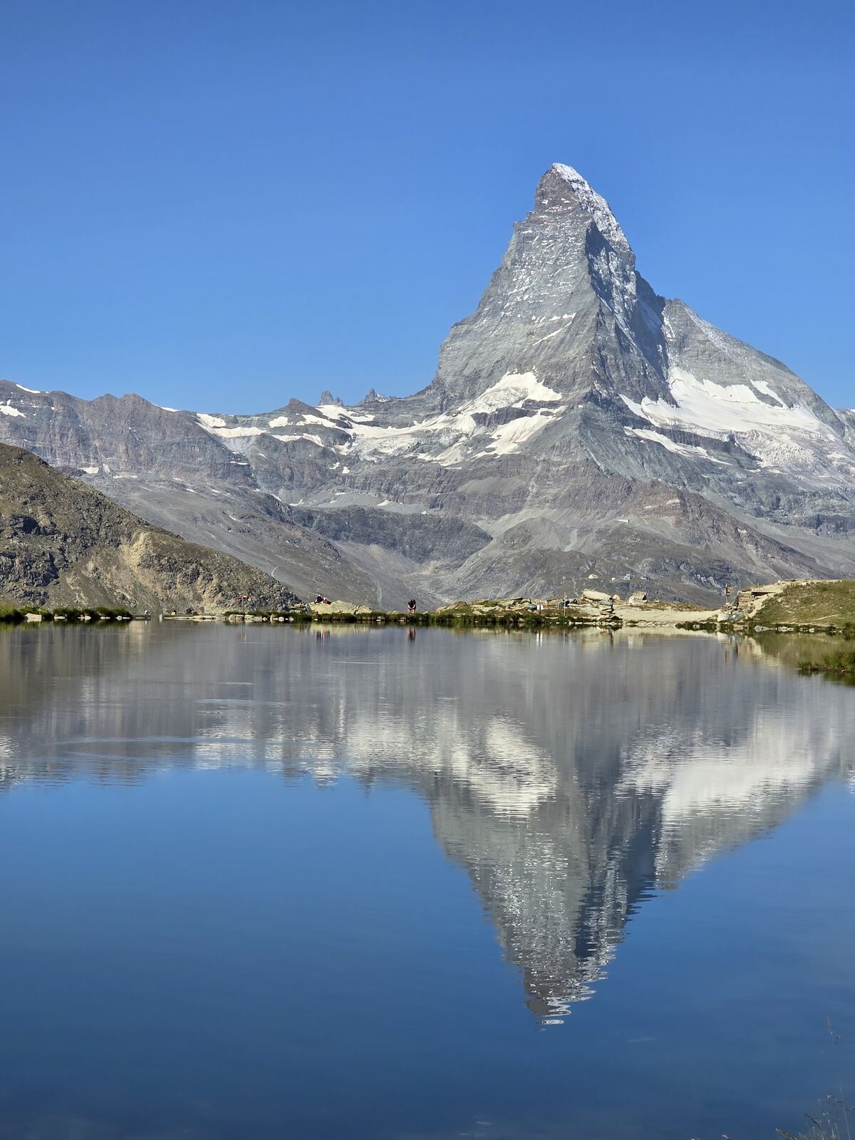 The Matterhorn above the car free village of Zermatt under snow